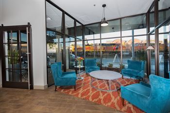 A glass wall with a view of a construction site behind it.